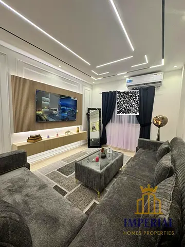 First occupant of a two-bedroom flat with a living room, newly furnished