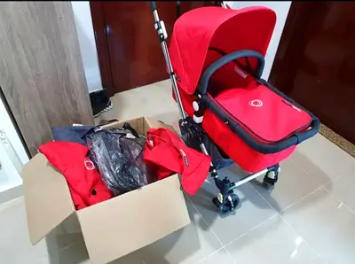 Red Bugaboo Pram Stroller with Accessories