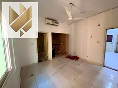 A studio apartment for rent in Muwaileh Al Qadimah, featuring a semi-open kitchen in a prime locatio