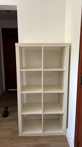 Clean white 3x3 cube bookshelf with 8 spacious compartments, in excellent condition perfect for book