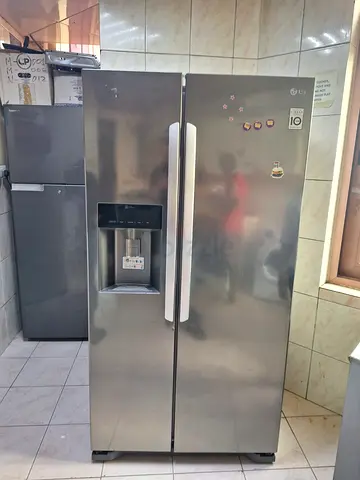 LG Side-by-Side Refrigerator with Water Dispenser - Good Working Condition
