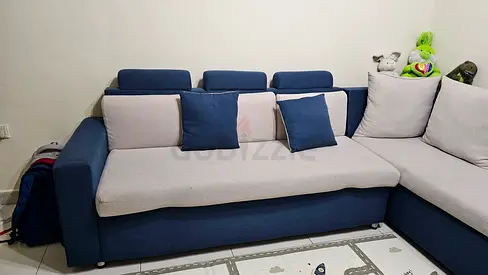 L-shaped blue and light-grey fabric corner sofa - good condition