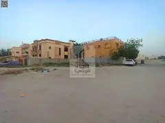 Land with street and alley for sale, prime location next to the mosque