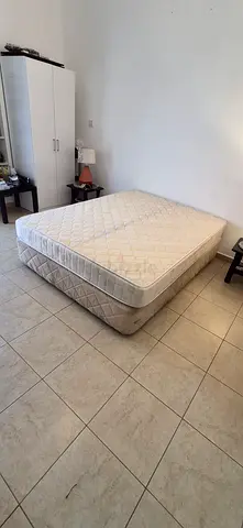 Queen size Bed with Mattress cream color in good condition. Mattress is medical type of Sleepfine br