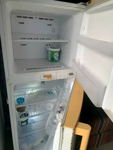 Small double-door refrigerator in working condition