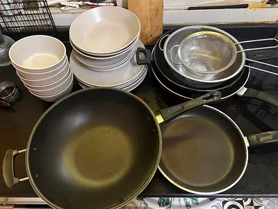 Used non-stick frying pans, wok, strainers and ceramic bowls - set of kitchen cookware