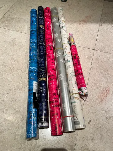 Mixed Rolls of Gift Wrapping Paper, Happy Birthday, Christmas etc some used, some unused.