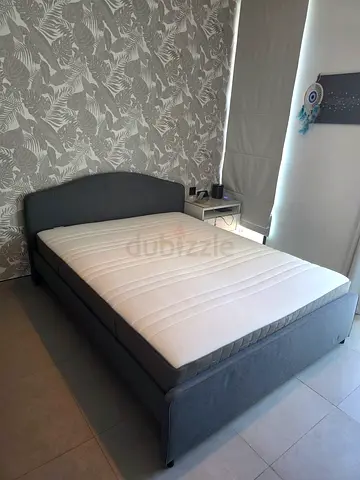 Grey fabric double bed frame with mattress - good condition