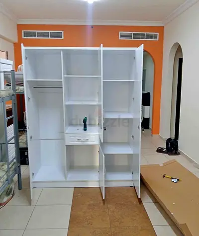 Spacious White 3-Door Wardrobe with Shelves and Drawer