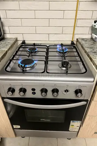 Stainless Steel 4-Burner Gas Stove with Oven - Good Working Condition