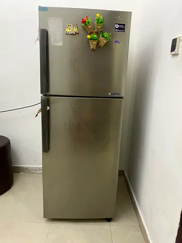 Used top-freezer stainless steel refrigerator - good working condition