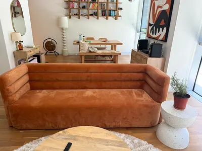 Orange Three-seater caramel velvet sofa in good condition