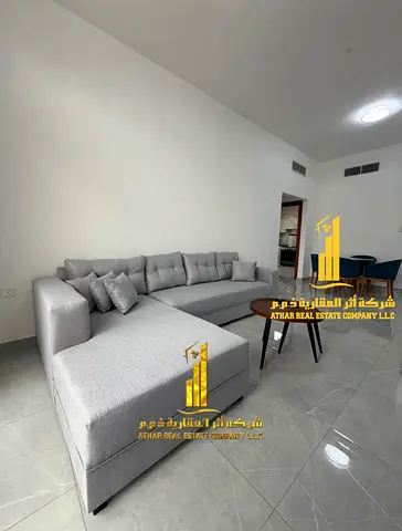 Beautiful furnished one-bedroom apartment with new furniture for monthly rent in Ajman - Al Rashidiya 2 - next to the Ruler's Palace