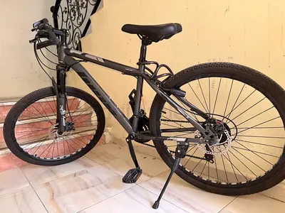 Used grey mountain bike with front suspension and disc brakes