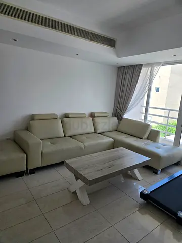 Sofa with chaise lounge and separate ottoman