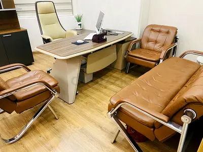 Brown leather office sofa set with matching visitor chairs