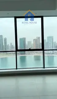 Two bedrooms and a living room for sale with a side view of Al Mamzar beach