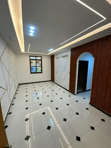 Two-bedroom apartment with a living room for annual rent in Rawda 3, next to Sheikh Ammar Bin Humaid Street