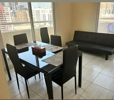 Black Glass Top Dining Table with 4 Chairs + Sofa Bed - Good Condition