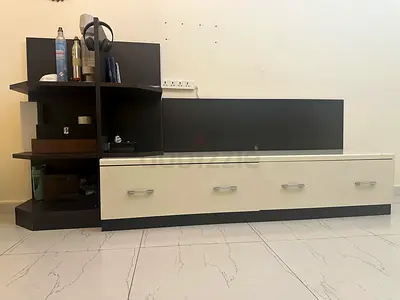 Low modern TV unit with open Books shelving and drawers