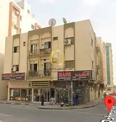 Corner commercial building for sale in Al Butinah area