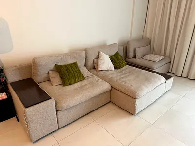 Light beige fabric sofa with hidden wooden storage armrest - good condition