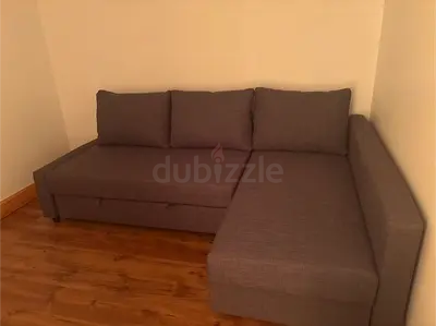 L-shaped grey fabric corner sofa bed, good condition