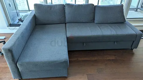 Grey L-shaped Fabric Sofa Bed with Storage — Good Condition
