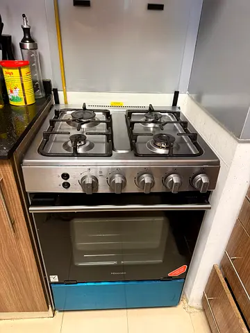 Hisense Used 4-Burner Stainless Steel Gas Stove with Oven - Excellent condition.