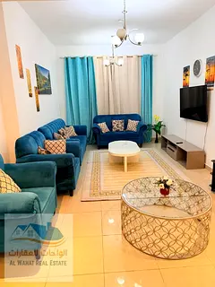 Now available in Sharjah, Al Khan, Rose Tower: a spacious two-bedroom apartment with a living room a