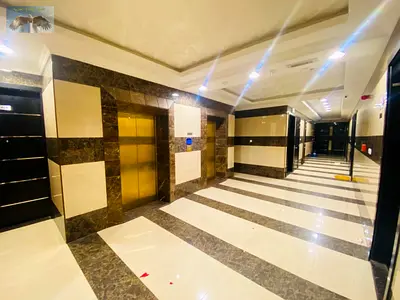 For annual rent in Ajman, Al Rawda area: two bedrooms and a living room with free parking and one month free. Located on Sheikh Khalifa Street, next t