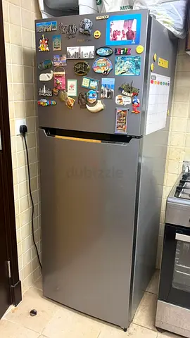 Used two-door refrigerator in good working condition, stainless finish