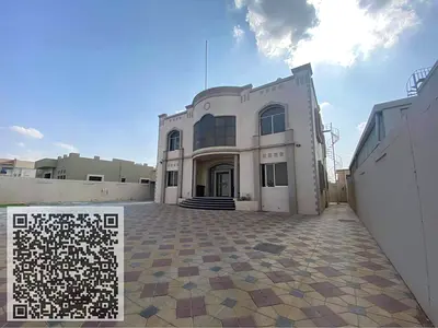 Villa for annual rent in Al Raqaib area, Ajman, exclusively for UAE nationals. Features 4 master bedrooms and a large living area.