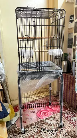 Tall metal bird cage on stand with wheels - good condition (new)