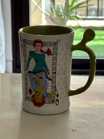 Decorative ceramic mug with unique handle