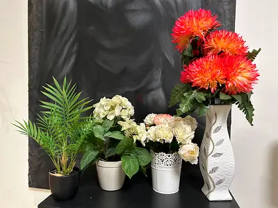 Artificial flowers and plant in vase pots