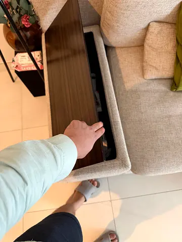 Light beige fabric sofa with hidden wooden storage armrest - good condition