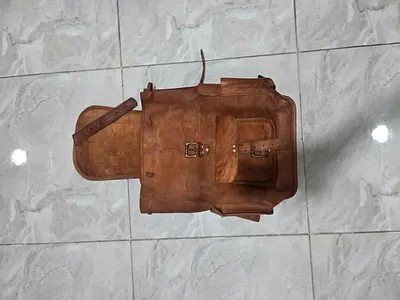 Vintage brown leather backpack with front pockets