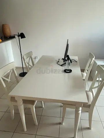Solid white wooden dining table with 4 chairs - excellent condition