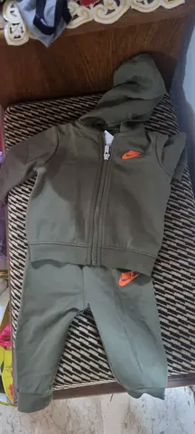 Baby green hooded one-piece romper (size small) - gently used