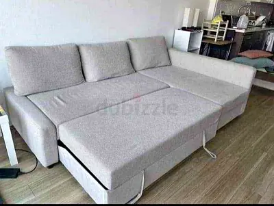 Grey L-Shaped Sofa Bed with Pull Out Section