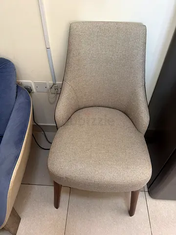 Light beige upholstered dining/occasional chair with wooden legs - good condition