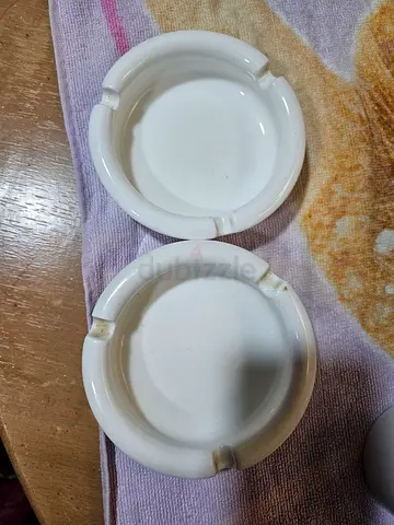 Set of classic white ceramic ashtrays