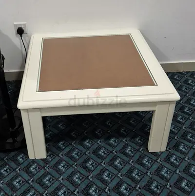 Two solid wood side tables with glass top