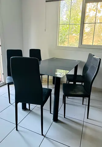 Black Glass Top Dining Table with 6 Modern Chairs - Good Condition