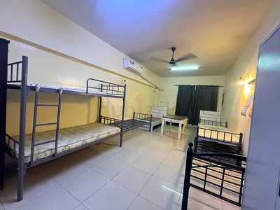 Exicutive bachelor very big Hall room available in near karama day to day for 8 people
