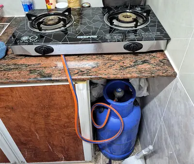 Two-Burner Gas Stove with Connected LPG Cylinder (Used),tube, regulator valve,