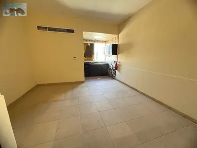 Studio apartment with central air conditioning available for annual rent in Al Rashidiya