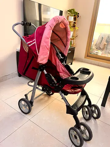 Lightly Used Pink Baby Stroller with Sun Canopy and Snack Tray
