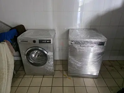 Front-load washing machine (stainless) and matching dishwasher - good working condition